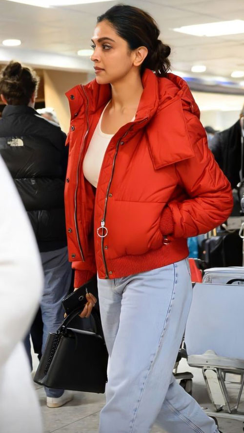 Deepika Padukone Winter wear - Red Puffer Jacket with ice blue jean and white top